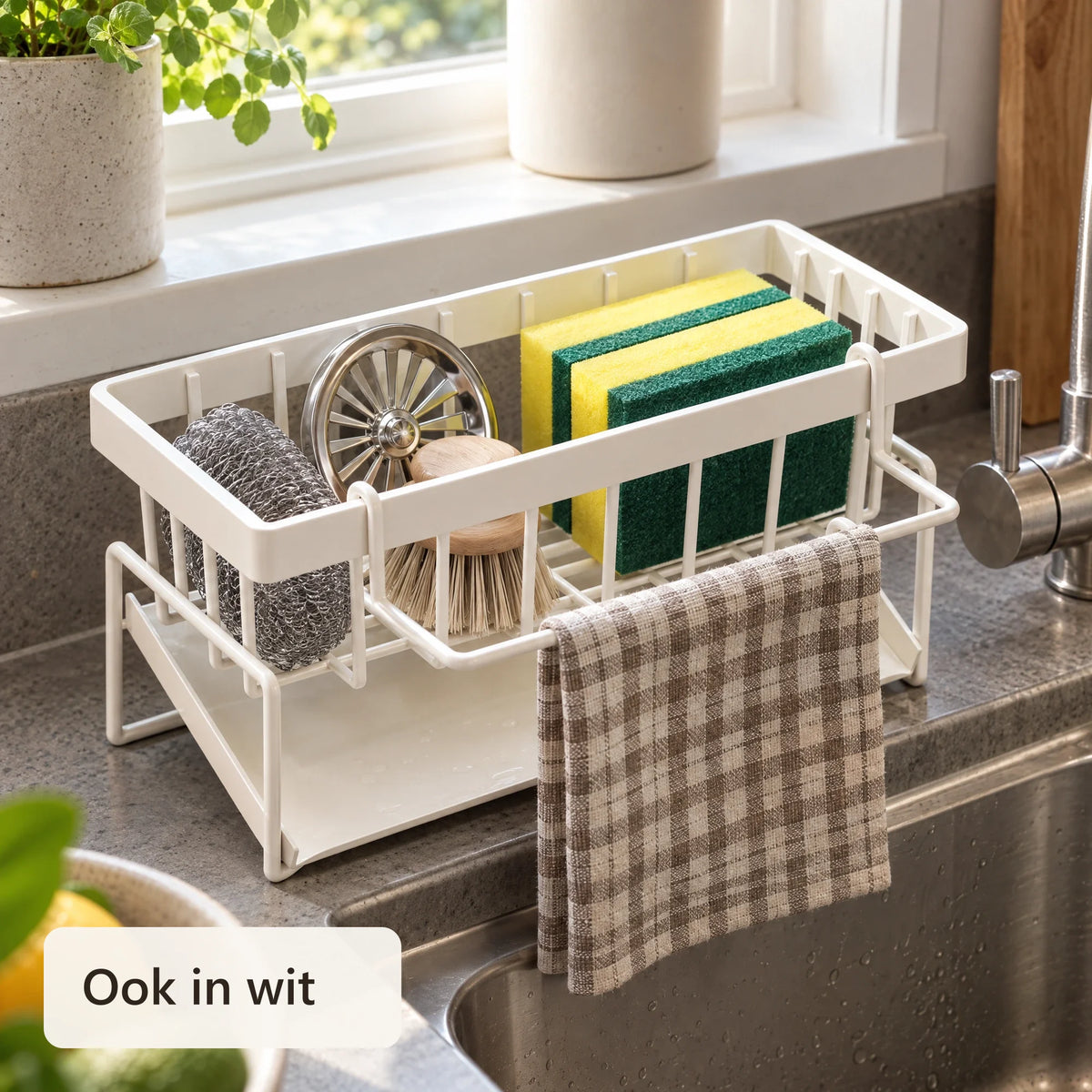 Witte gootsteen organizer met spons en theedoek