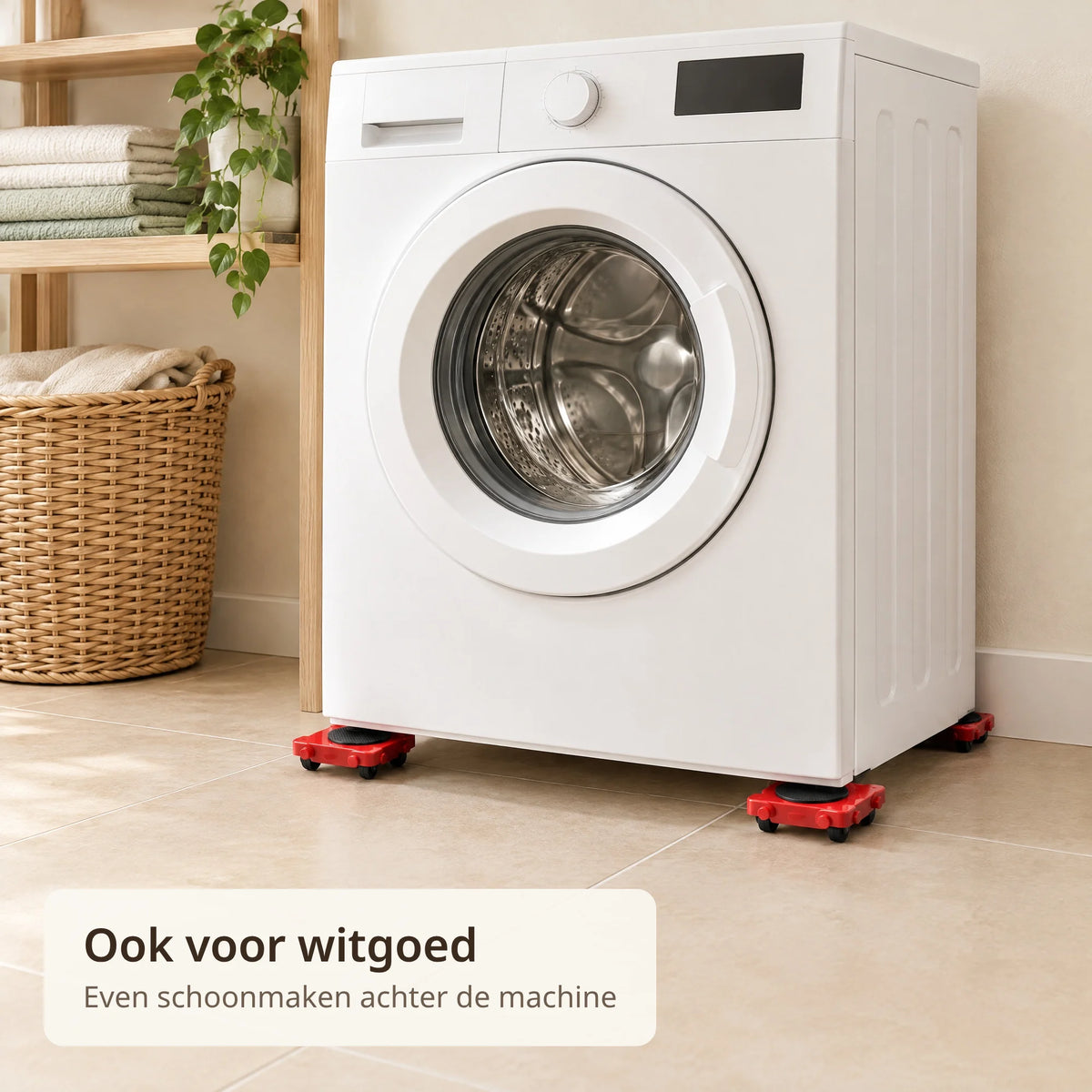 Witte wasmachine staat op rode transportrollers en is van de muur af gerold